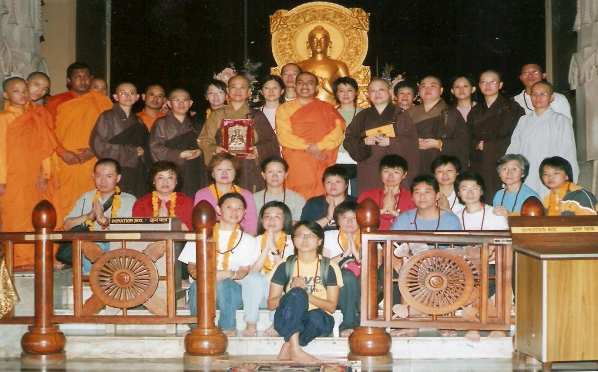 Group of Buddhist monks and pilgrims on a Buddhist pilgrimage tour